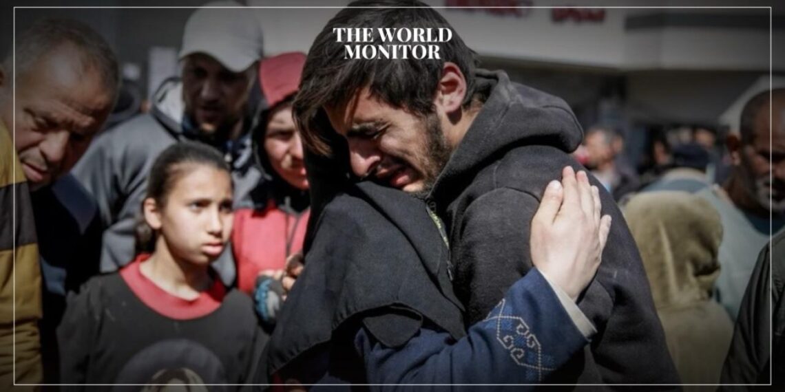 People mourn after dozens died while trying to get food at an aid distribution point in Gaza City on February 29, 2024. (Photo by AFP)
