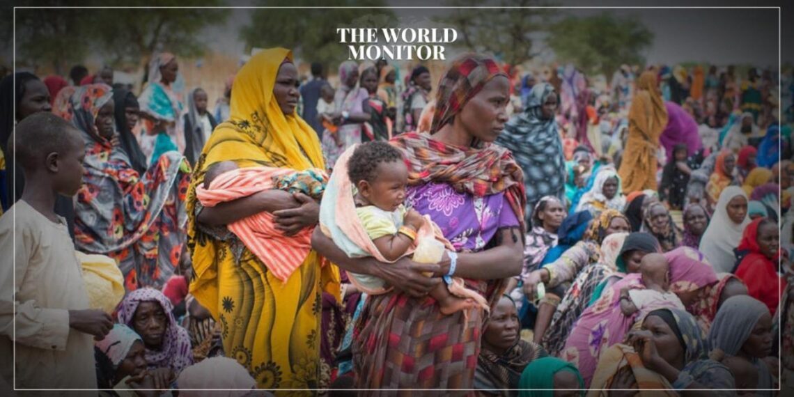 Hundreds of newly arrived Sudanese refugees gather to receive UNHCR relief kits at the Madjigilta site in Chad's Ouaddaï region. Sudan War Displaces Over 10 Million People